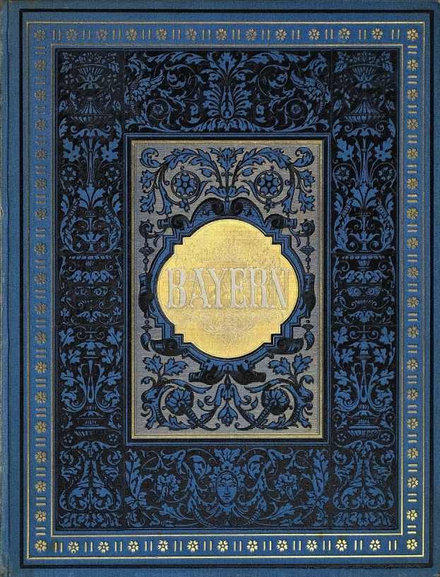 Ein blau-goldenes Buch mit der Aufschrift "Bayern", das mit kunstvollen Verzierungen versehen ist.