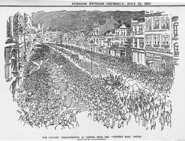 Schwarze und weiße Zeichnung einer Menge von Menschen, die eine von Gebäuden gesäumte Straße entlanggehen, mit der Überschrift 'Die Unionistendemonstration aus der Sicht des Western Mail Office' oben und unten.